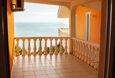 a balcony with a view of the ocean at Snežna Kraljica in Sutomore