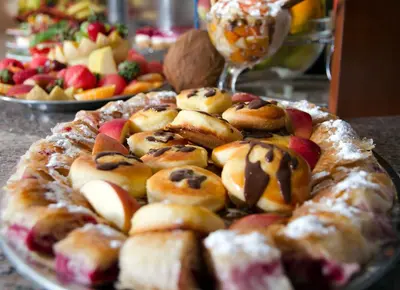 a tray of pastries and fruits on a table at Dolce Vita in Budva