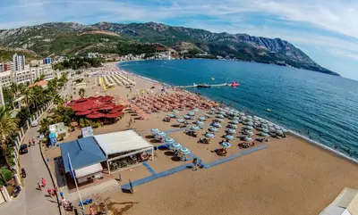 an aerial view of a beach with umbrellas and people at Dolce Vita in Budva
