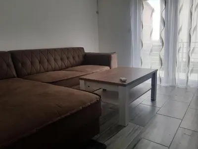 a living room with a couch and a coffee table at Apartment Danijela in Budva