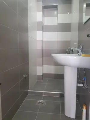 a bathroom with a sink and a shower at Apartment Danijela in Budva