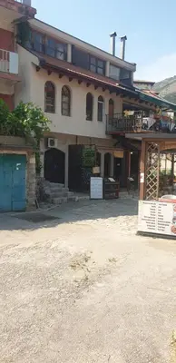 a large building with a gate in front of it at Apartment Old Town Stari Bar in Bar