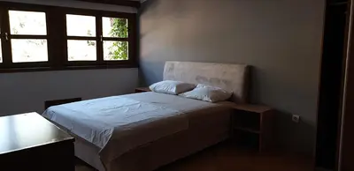 a small bedroom with a bed and a window at Apartment Old Town Stari Bar in Bar