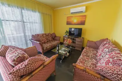 a living room with two couches and a tv at Villa Tivat in Tivat