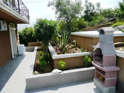 a garden on the side of a building at Villa Tivat in Tivat