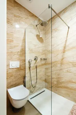 a bathroom with a toilet and a shower at Skyline Apartments by In Property in Becici