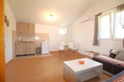a living room with a couch and a table at Apartments Stevan in Bar
