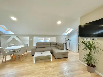 a living room with a couch and a table at Comfort Apartments Pasha in Budva