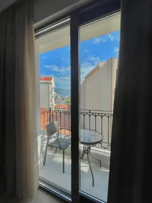 a view from a window of a balcony with a table at Comfort Apartments Pasha in Budva