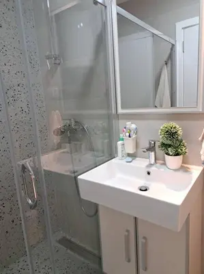 a bathroom with a shower and a sink and a shower at Mina in Budva
