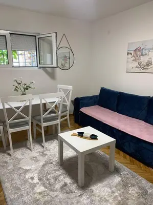a living room with a couch and a table at Mina in Budva