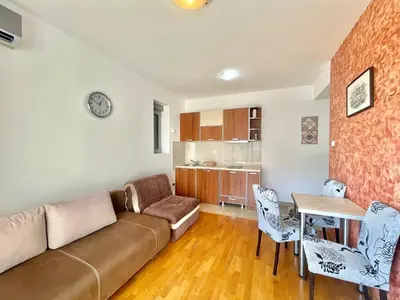 a living room with a couch and a table at Comfort Apartments Aleksic in Budva