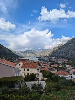 a view of a town with mountains in the background at Apartment Gara in Kotor