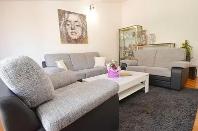 a living room with two couches and a coffee table at Apartments Andrija in Kotor