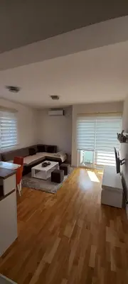 a living room with a couch and a table at RELAX in Podgorica