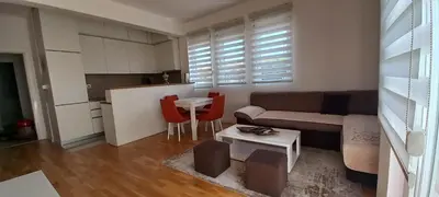 a living room with a couch and a table at RELAX in Podgorica