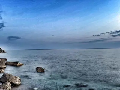 a view of the ocean with rocks in the water at Apartments Vinka&Mila in Sutomore