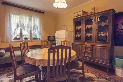 a dining room with a table and some chairs at Apartments Vinka&Mila in Sutomore