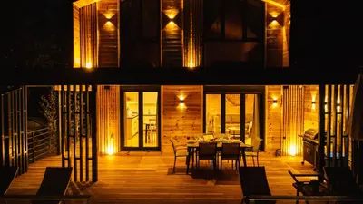 two pictures of a house with a dining room with lights at Congo Bungalow in Ulcinj