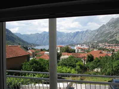 a view from a window of a city and mountains at Guest House Sandra in Kotor