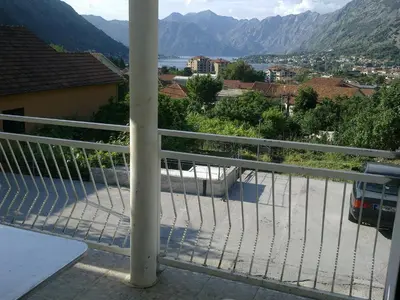 a balcony with a view of the mountains at Guest House Sandra in Kotor