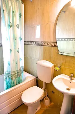 a bathroom with a toilet and a sink at Apartments Kordic in Budva