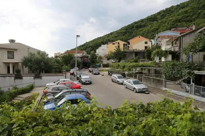 a group of cars parked in a parking lot at Apartments Kordic in Budva