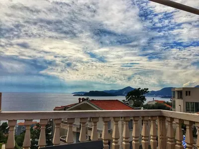a view of the ocean from a balcony at Apartments Dunja in Sveti Stefan