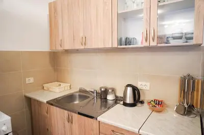 a kitchen with a sink and a counter top at Apartment Marija in Budva