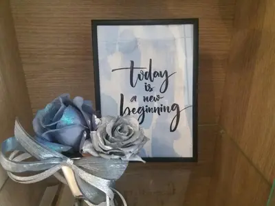 a picture of a flower with a sign that says today is a new beginning at Apartment Marija in Budva