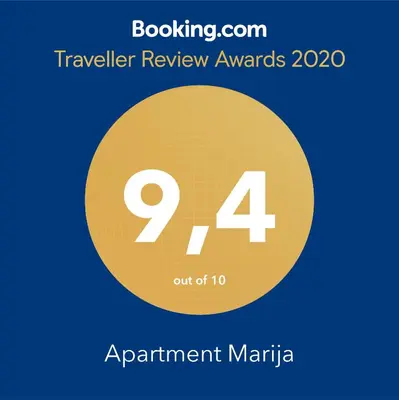 a sign that reads travel review awards with a yellow circle at Apartment Marija in Budva