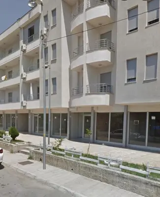 an apartment building with windows and a street light at Stex Urban 4 in Podgorica