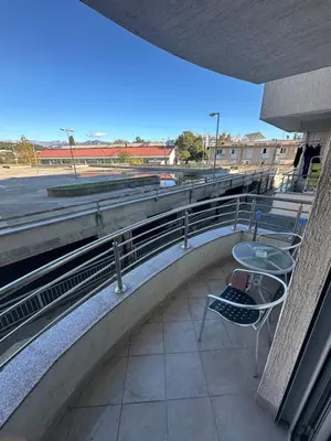 a balcony with a table and chairs on a building at Stex Urban 4 in Podgorica