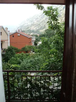 a view of a mountain from a window at Apartments Škaljari in Kotor