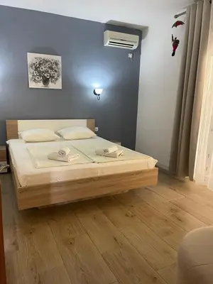 a bedroom with a bed in a room at Guesthouse HHL - Liman ll in Ulcinj