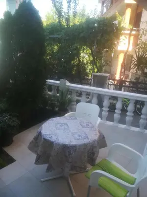 a table and two chairs on a patio at Apartments Dijana in Budva