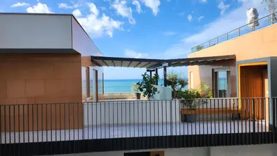 a house with a view of the ocean at Marelis condo with sea view in Ulcinj