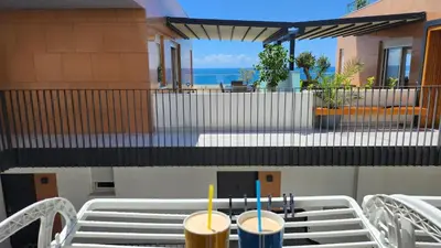 a table with two drinks on top of it at Marelis condo with sea view in Ulcinj