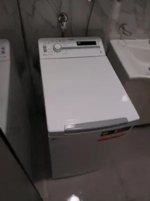 a white machine sitting on a counter next to a sink at Obilex in Podgorica
