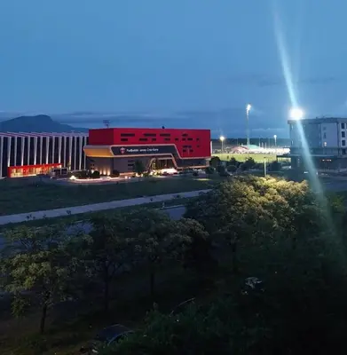 a large red building in front of a building at Obilex in Podgorica