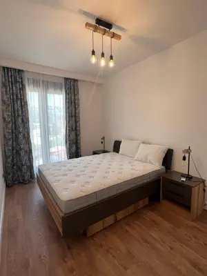 a bedroom with a large bed and a window at Kabaseo Spa in Becici