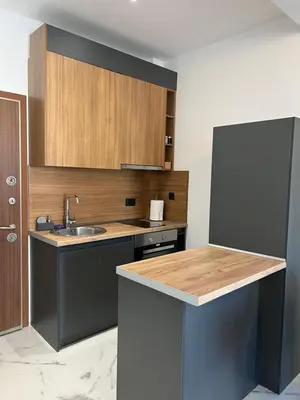 a kitchen with a sink and a counter top at Kabaseo Spa in Becici