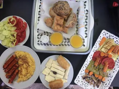 a tray of food with different types of food and drinks at Apartments OldTown in Podgorica