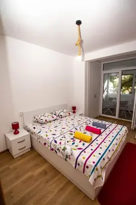 a bedroom with a bed with toys on it at Milan apartment in Bar