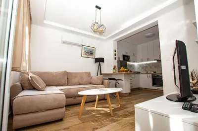 a living room with a couch and a table at Milan apartment in Bar