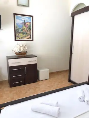 a bathroom with a large mirror and a sink at Apartments Moracanin in Sutomore