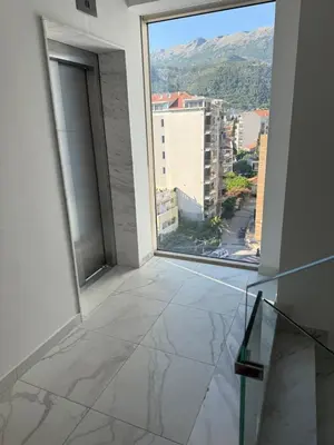 an empty room with a view of a city at Seabreeze apartments Budva in Budva