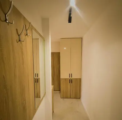 a room with wooden cabinets and a hallway at SereneHaven in Kotor