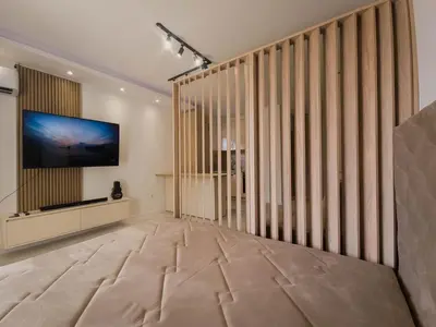 a large living room with a flat screen tv on a wall at SereneHaven in Kotor