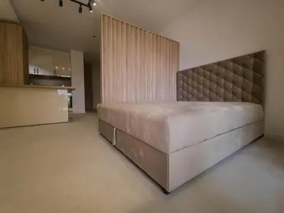 a bedroom with a large bed in a room at SereneHaven in Kotor